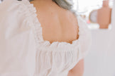 White Puff Sleeve Tunic with Ruffle Trim and Bow Details